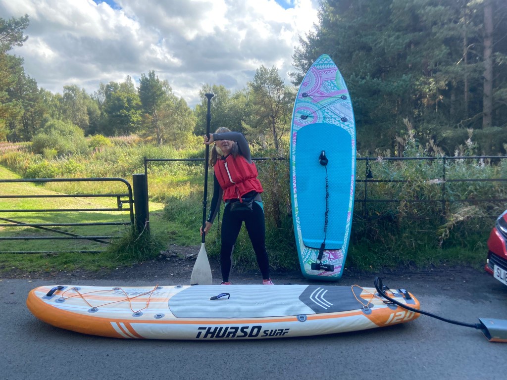 2 inflatable paddle boards getting ready to launch