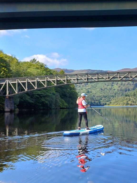 Paddleboarding under faskally loch bridge